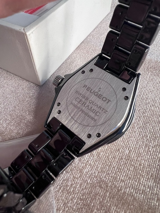 Peugeot black ceramic watch featuring a crystal-set bezel and dial markers. main image 4